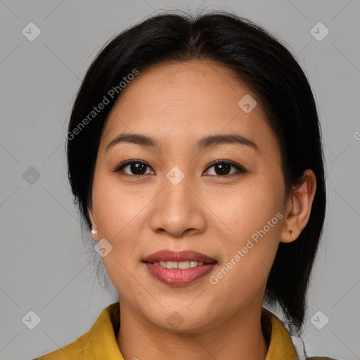 Joyful latino young-adult female with medium  brown hair and brown eyes