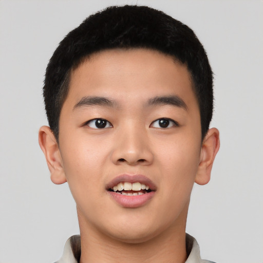 Joyful asian young-adult male with short  black hair and brown eyes