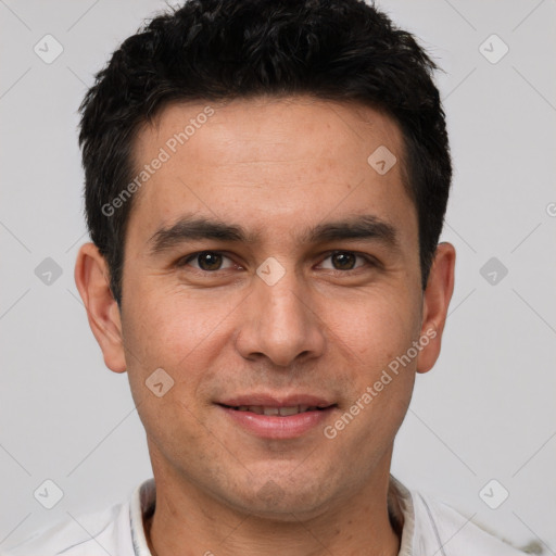 Joyful white young-adult male with short  black hair and brown eyes