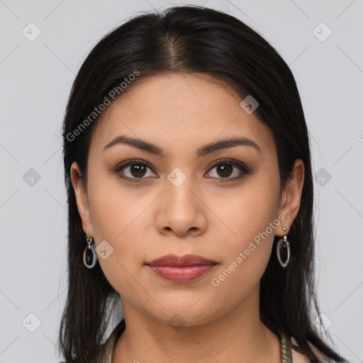 Joyful latino young-adult female with long  brown hair and brown eyes