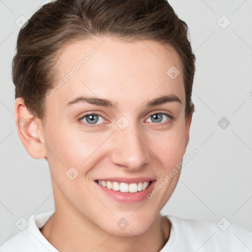 Joyful white young-adult female with short  brown hair and grey eyes