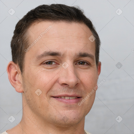 Joyful white adult male with short  brown hair and brown eyes