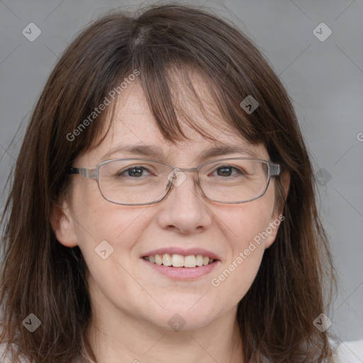 Joyful white adult female with medium  brown hair and grey eyes