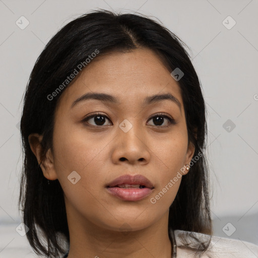 Neutral black young-adult female with medium  brown hair and brown eyes