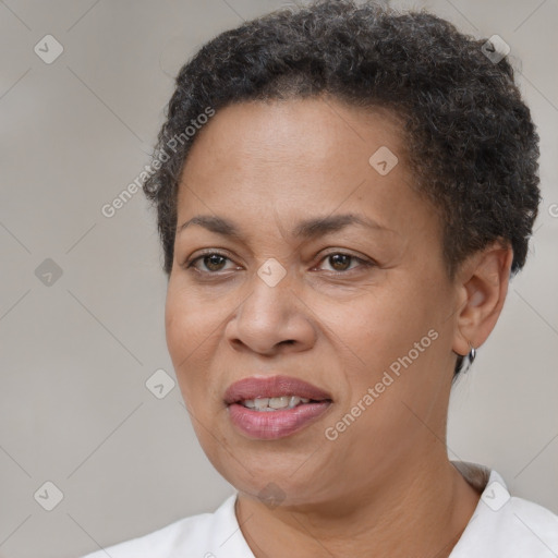 Joyful latino adult female with short  brown hair and brown eyes