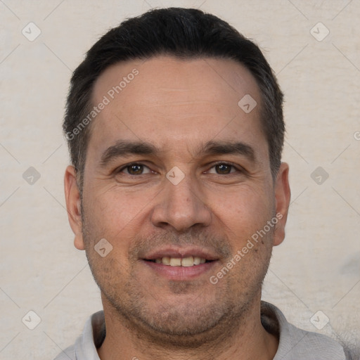 Joyful white adult male with short  brown hair and brown eyes