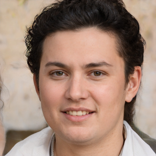 Joyful white young-adult male with medium  brown hair and brown eyes