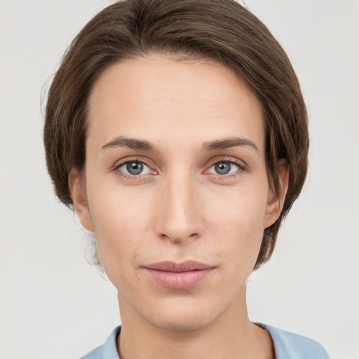 Neutral white young-adult female with short  brown hair and grey eyes