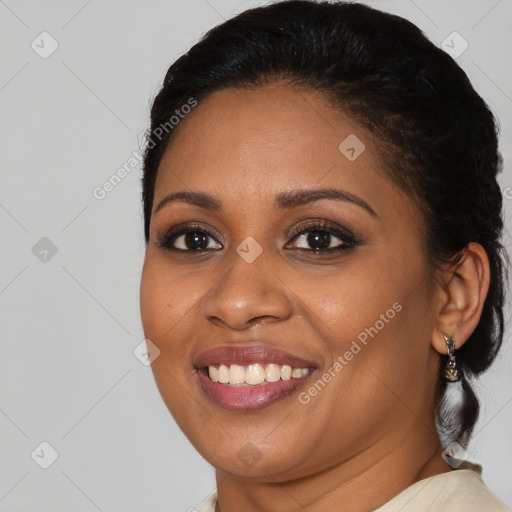 Joyful latino young-adult female with medium  brown hair and brown eyes