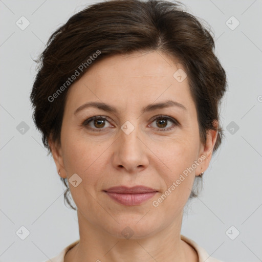 Joyful white adult female with short  brown hair and brown eyes