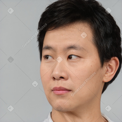Neutral asian young-adult male with short  black hair and brown eyes