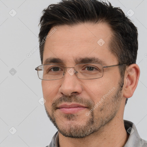 Joyful white adult male with short  brown hair and brown eyes