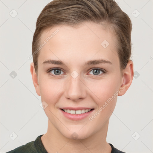 Joyful white young-adult female with short  brown hair and grey eyes