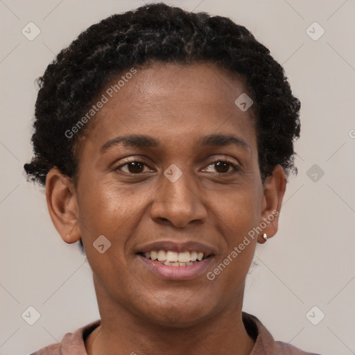 Joyful black young-adult female with short  brown hair and brown eyes