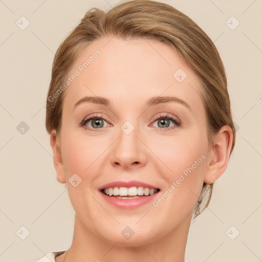 Joyful white young-adult female with medium  brown hair and green eyes