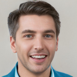 Joyful white young-adult male with short  brown hair and grey eyes