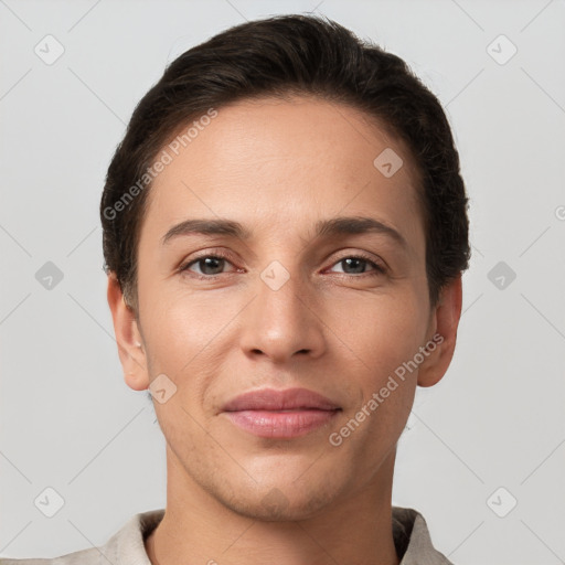 Joyful white young-adult female with short  brown hair and grey eyes