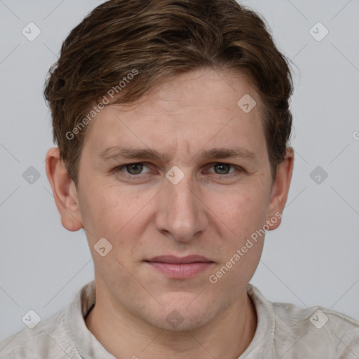 Joyful white adult male with short  brown hair and grey eyes