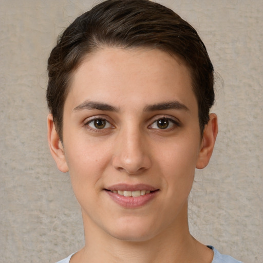 Joyful white young-adult female with short  brown hair and brown eyes