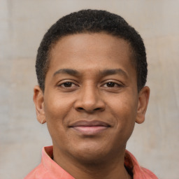 Joyful latino young-adult male with short  brown hair and brown eyes