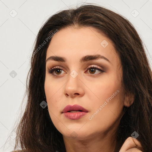 Neutral white young-adult female with long  brown hair and brown eyes