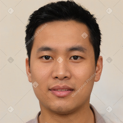 Joyful asian young-adult male with short  black hair and brown eyes