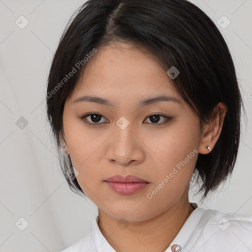 Joyful asian young-adult female with medium  black hair and brown eyes