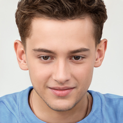 Joyful white child male with short  brown hair and brown eyes