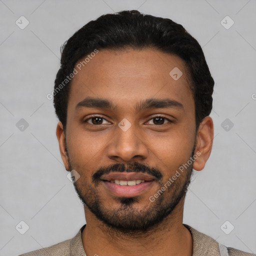 Joyful black young-adult male with short  black hair and brown eyes