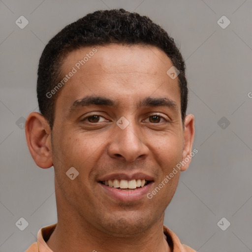 Joyful latino young-adult male with short  brown hair and brown eyes