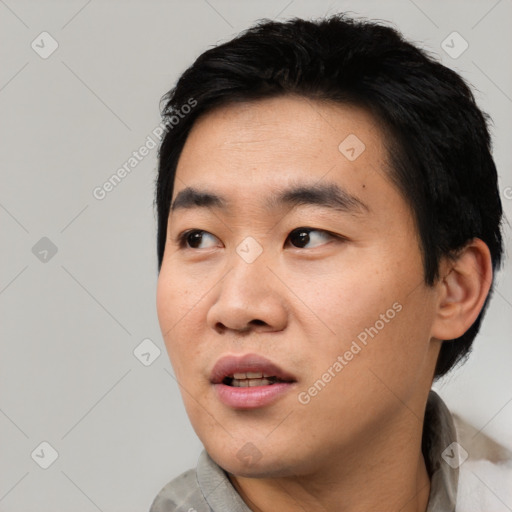Neutral asian young-adult male with short  black hair and brown eyes