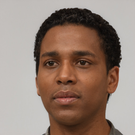 Neutral black young-adult male with short  black hair and brown eyes