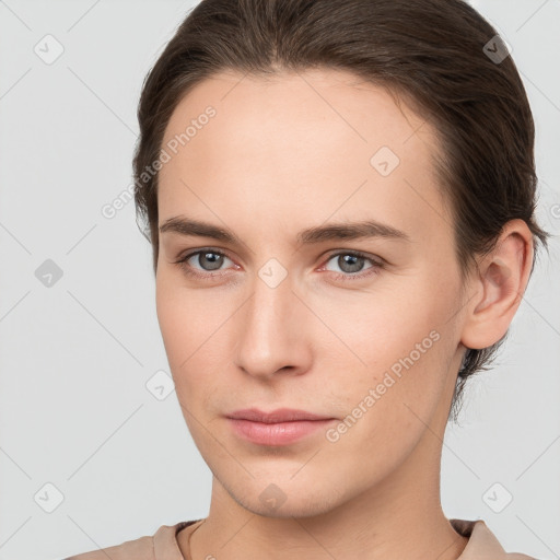 Neutral white young-adult female with short  brown hair and brown eyes