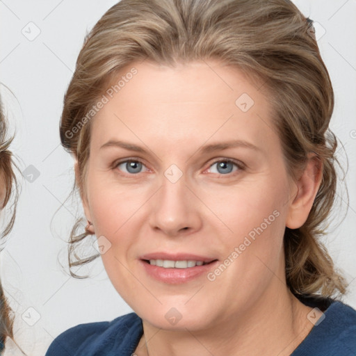 Joyful white young-adult female with medium  brown hair and blue eyes