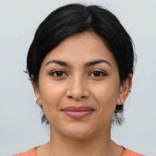 Joyful latino young-adult female with medium  black hair and brown eyes