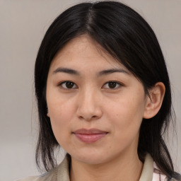 Joyful asian young-adult female with medium  black hair and brown eyes