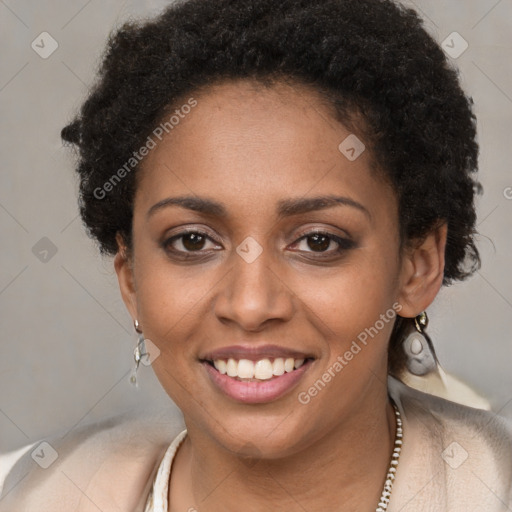 Joyful black young-adult female with short  brown hair and brown eyes