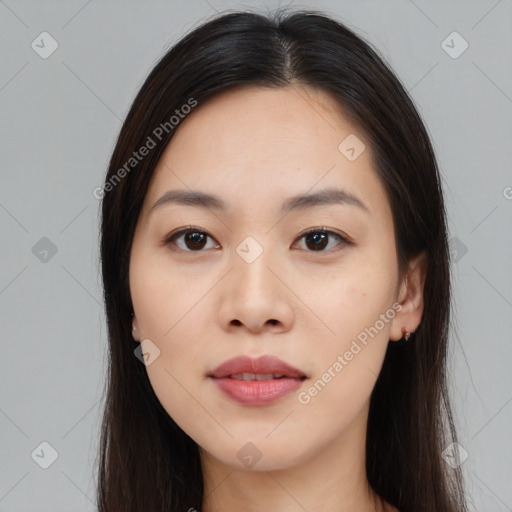 Joyful asian young-adult female with long  brown hair and brown eyes