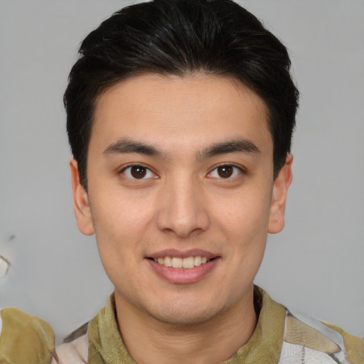 Joyful latino young-adult male with short  brown hair and brown eyes