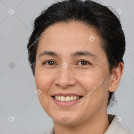 Joyful white adult female with short  brown hair and brown eyes