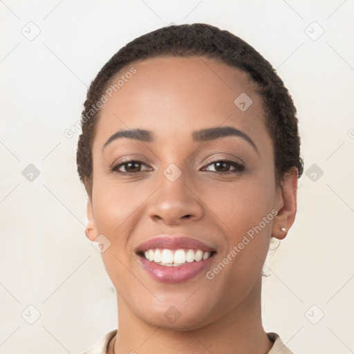 Joyful latino young-adult female with short  brown hair and brown eyes