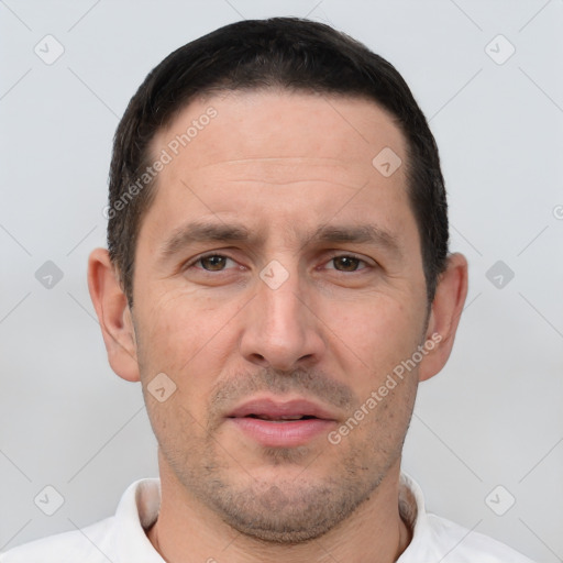 Joyful white adult male with short  brown hair and brown eyes