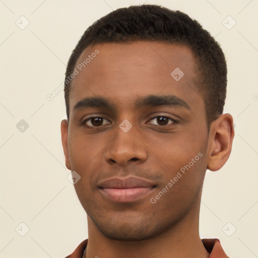 Joyful black young-adult male with short  brown hair and brown eyes