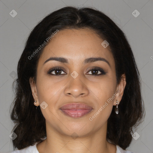 Joyful latino young-adult female with medium  brown hair and brown eyes