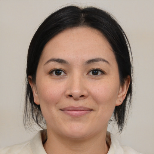 Joyful white young-adult female with medium  brown hair and brown eyes