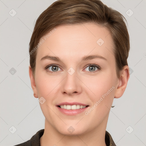 Joyful white young-adult female with short  brown hair and grey eyes