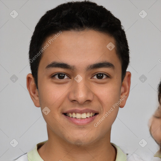 Joyful latino young-adult male with short  brown hair and brown eyes