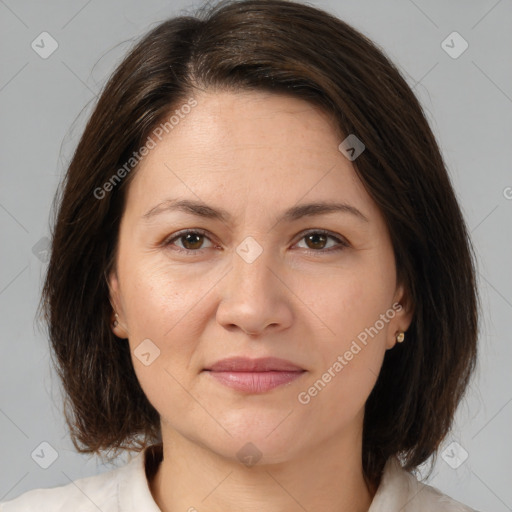 Joyful white adult female with medium  brown hair and brown eyes