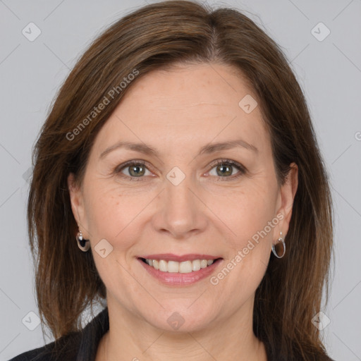 Joyful white adult female with medium  brown hair and brown eyes