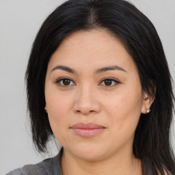 Joyful asian young-adult female with medium  brown hair and brown eyes